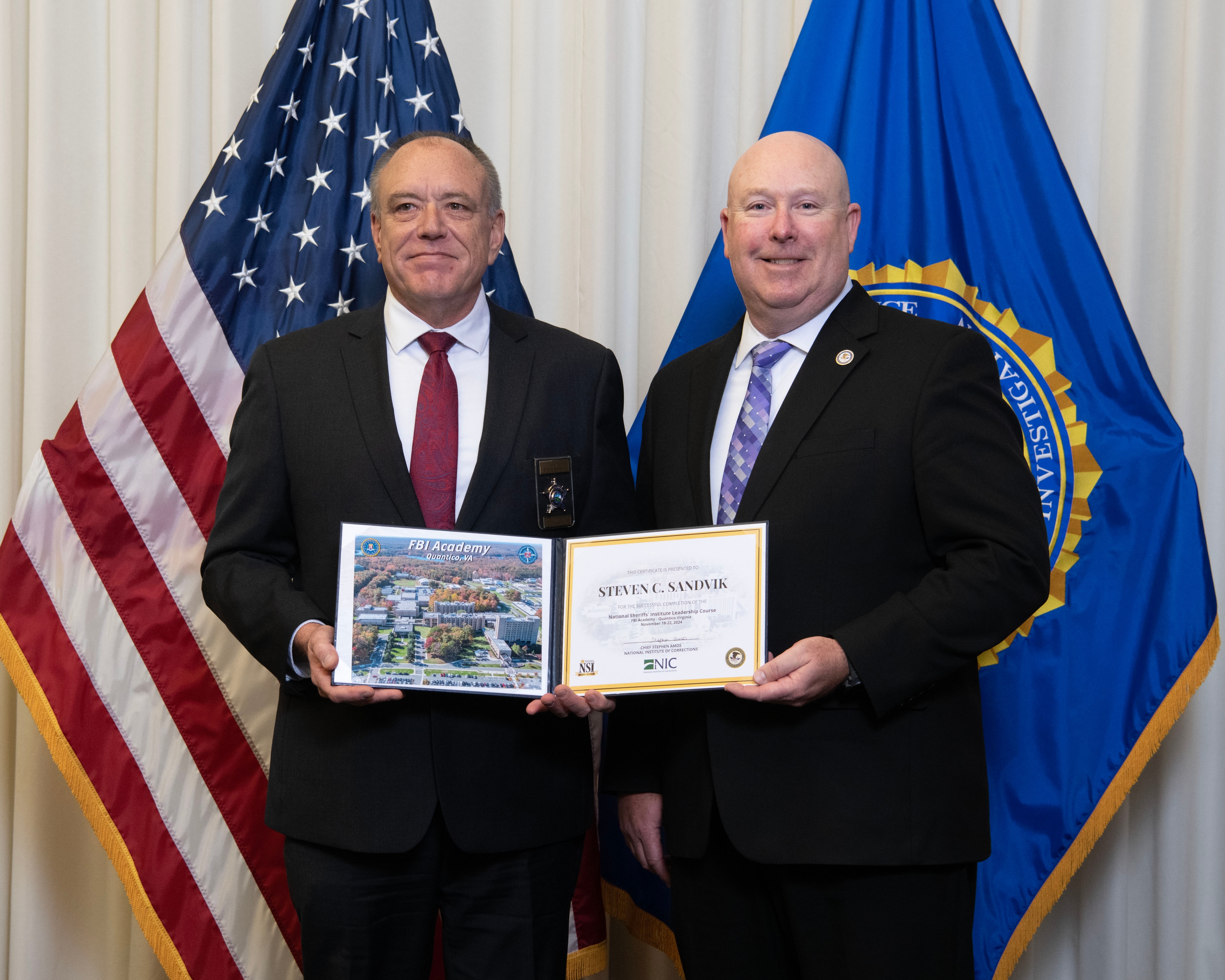 Sheriff Steve Sandvik receiving his National Sheriffs' Institute Leadership Course certificate at the FBI Academy, Quantico, Virginia