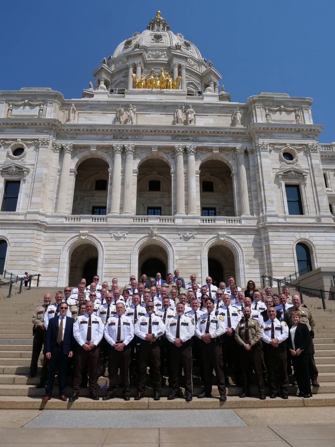 Minnesota sheriffs and law enforcement officials gathered on the steps of the Minnesota State Capitol
